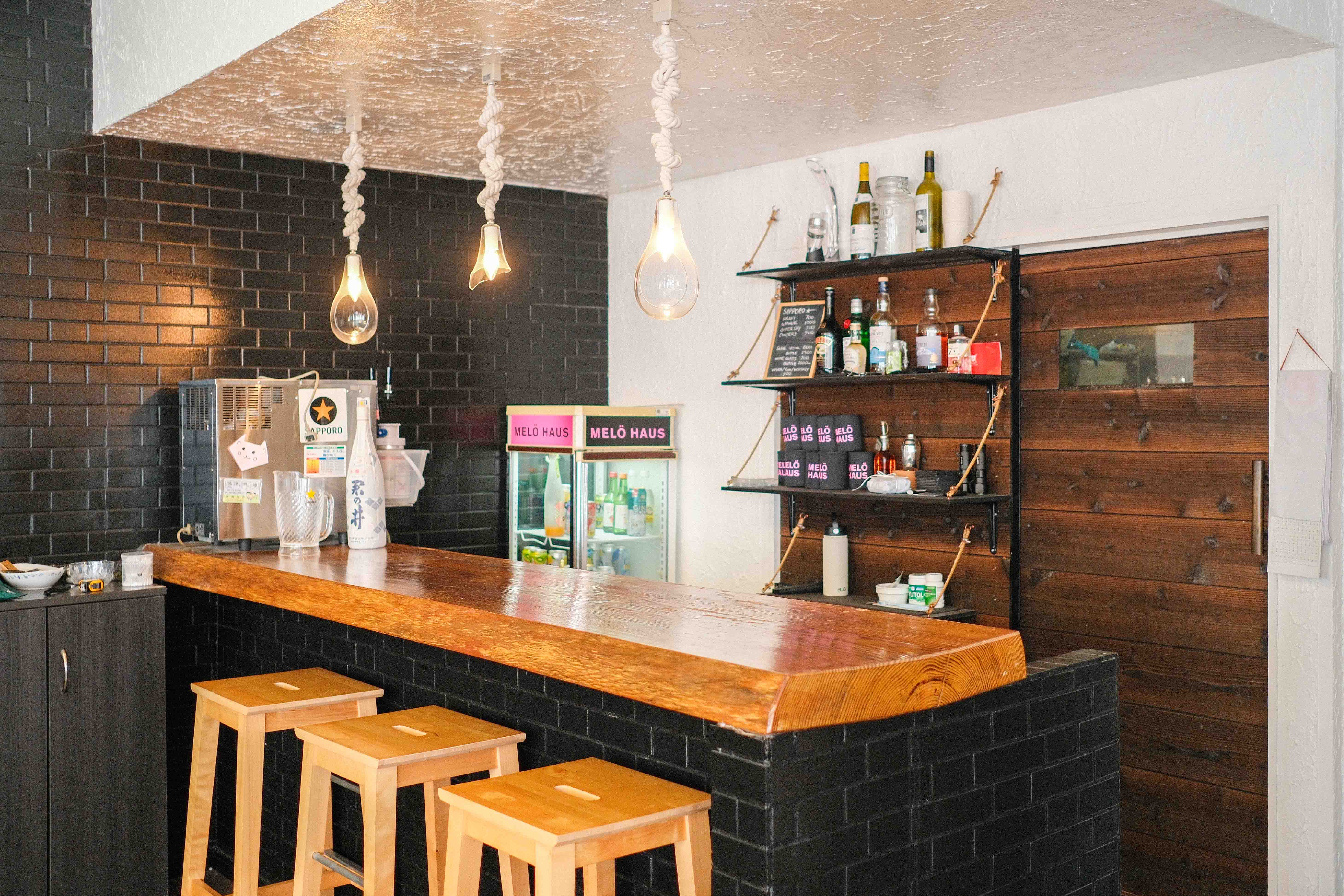 Bar with Sapporo on tap and rope pendant lights